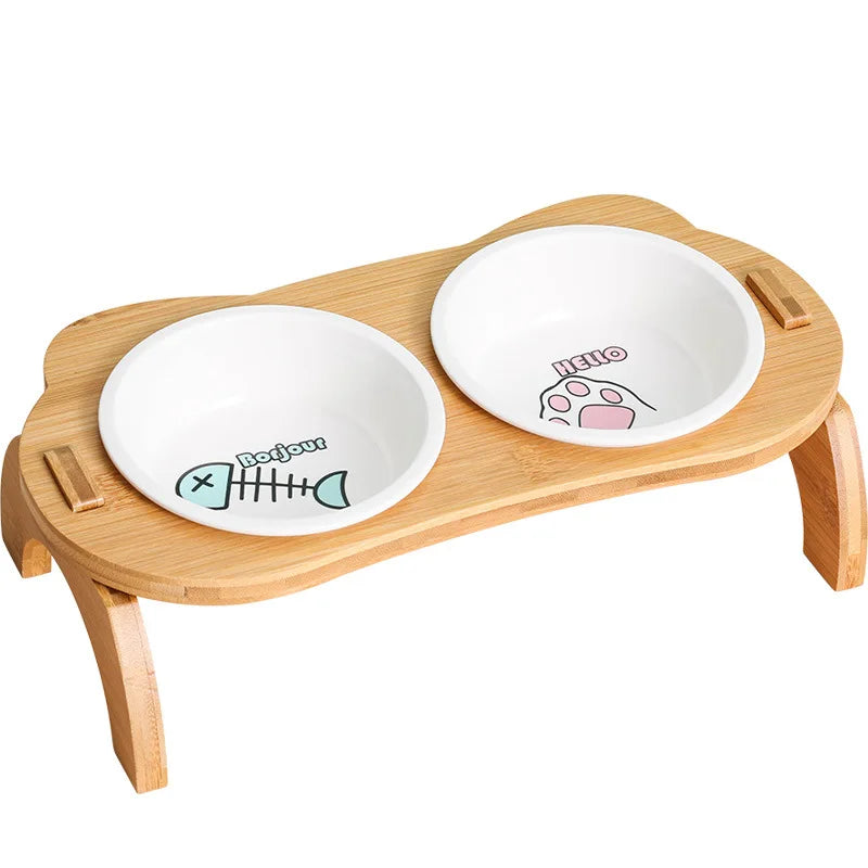 Elevated cat bowls with two ceramic bowls set in a bamboo stand, perfect for improving cat and small dog digestion and reducing joint strain during mealtime.